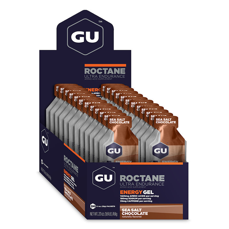 Gel energético GU Roctane con cafeína sabor arándano y granada, caja con 24 unidades, ideal para resistencia y rendimiento.